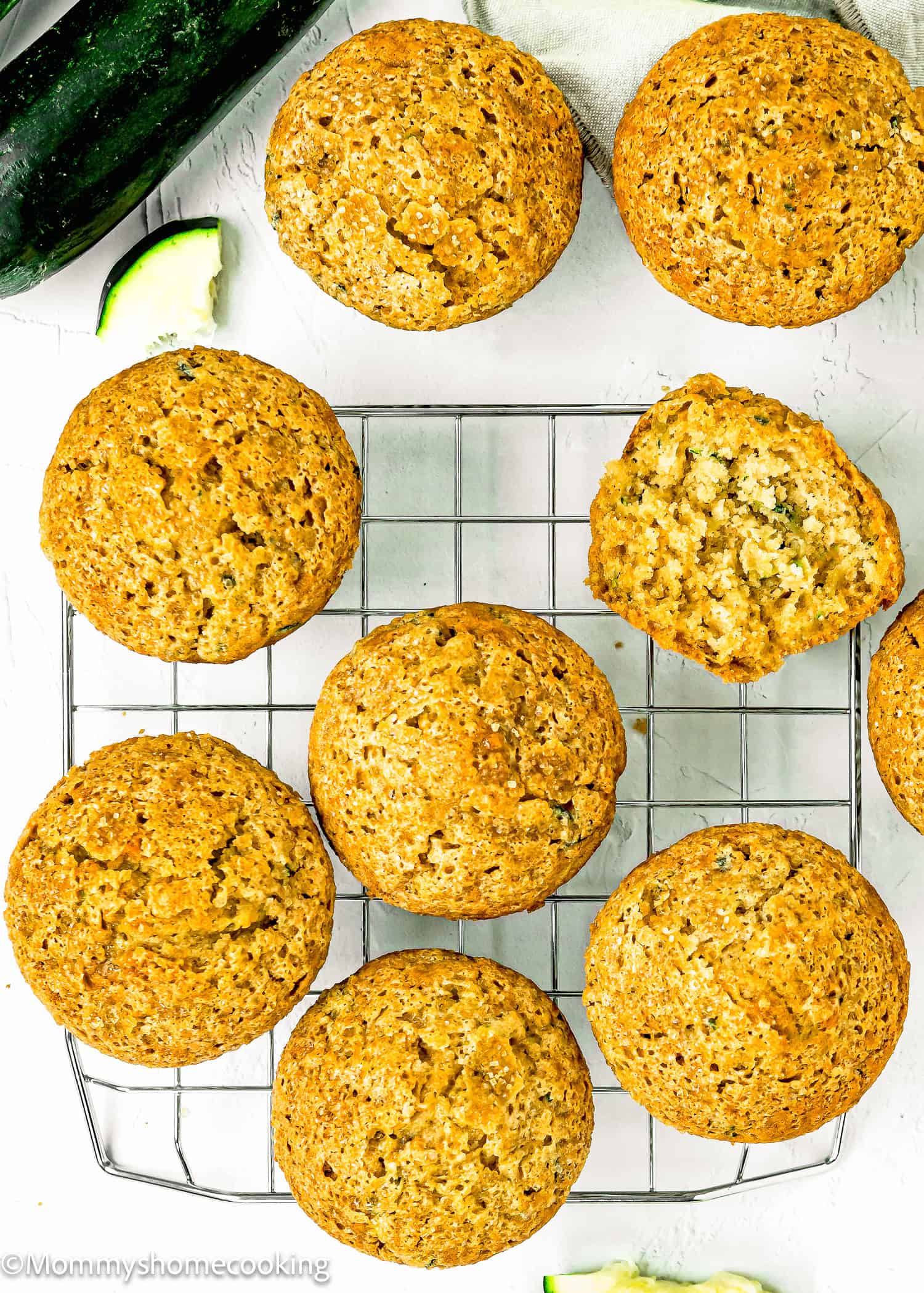 egg-free and dairy-free Zucchini Muffins over a cooling rack over a white surface.