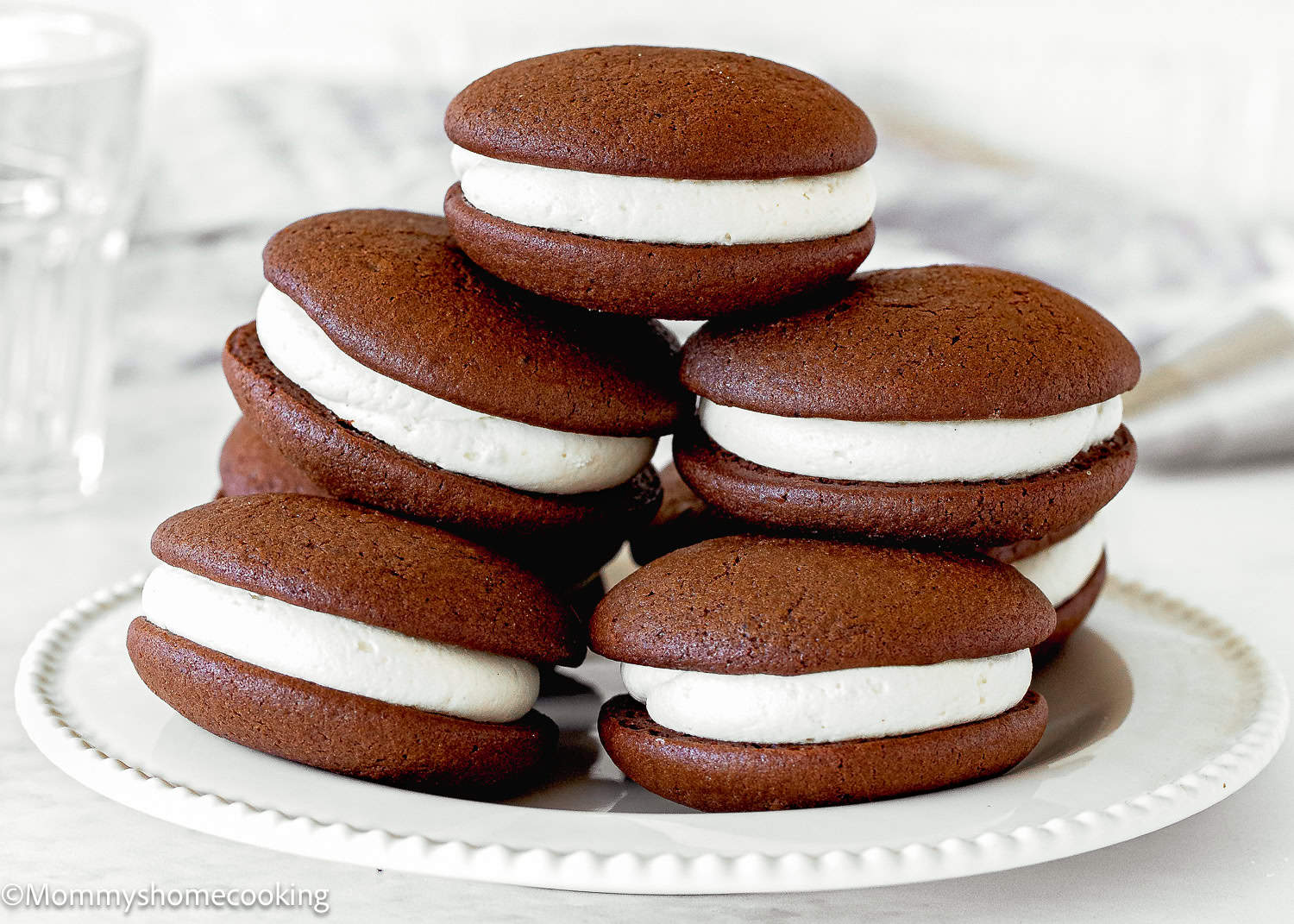 Egg-Free Chocolate Whoopie Pies over a white plate.