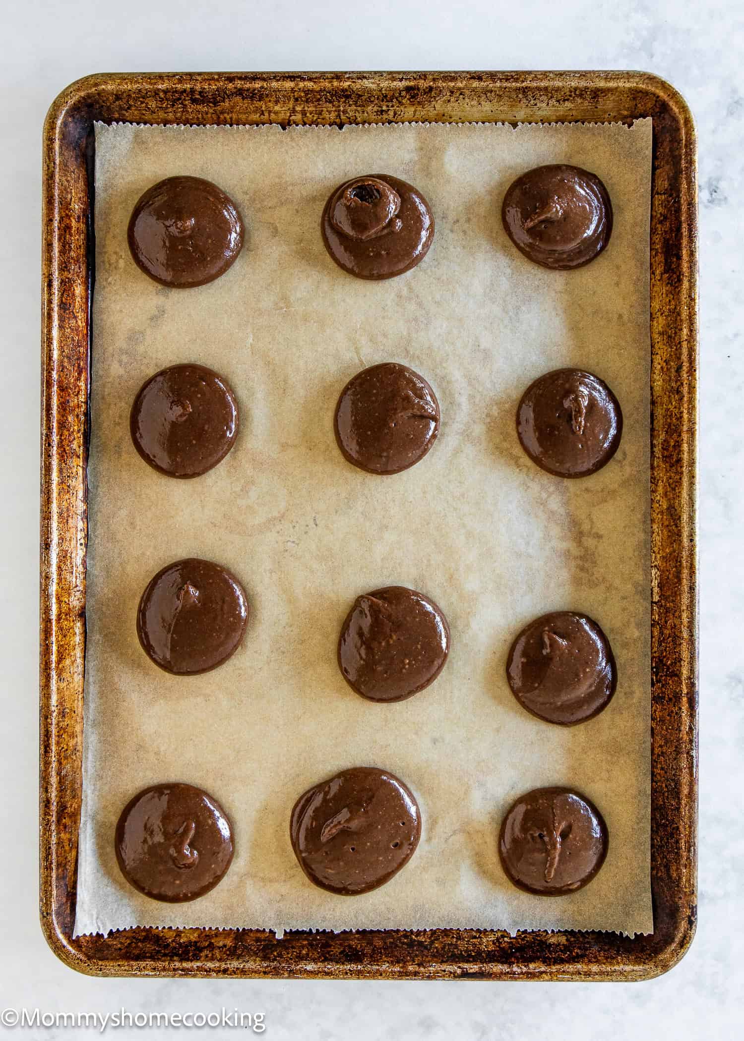 unbaked Chocolate Whoopie Pies in a baking tray.