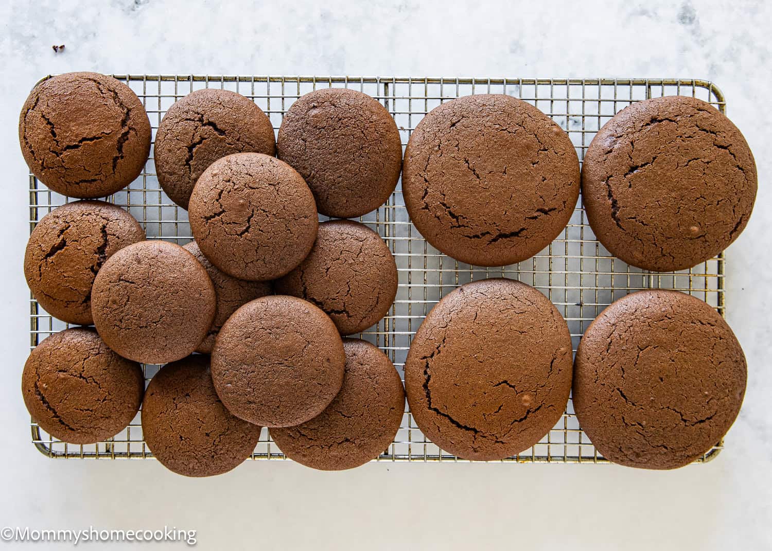 Easy Chocolate Whoopie Pies over a cooling rack.
