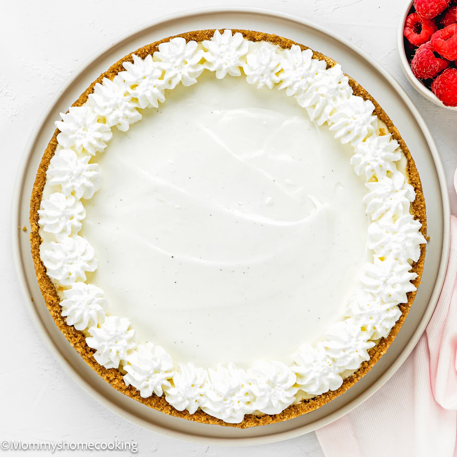 overhead view of a whole Easy No Bake Cheesecake over a serving plate.