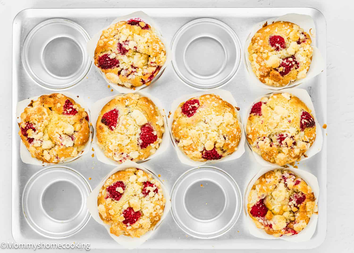 baked Easy Vegan Raspberry Muffins in a muffins tin.