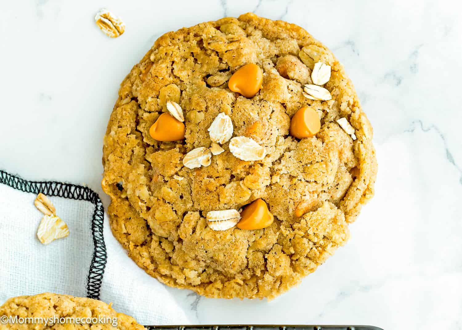 baked Eggless Easy Oatmeal Scotchies Cookie over a marble surface.