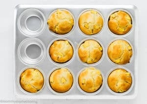 baked Vegan Easy Peach Muffins in a muffin tin.