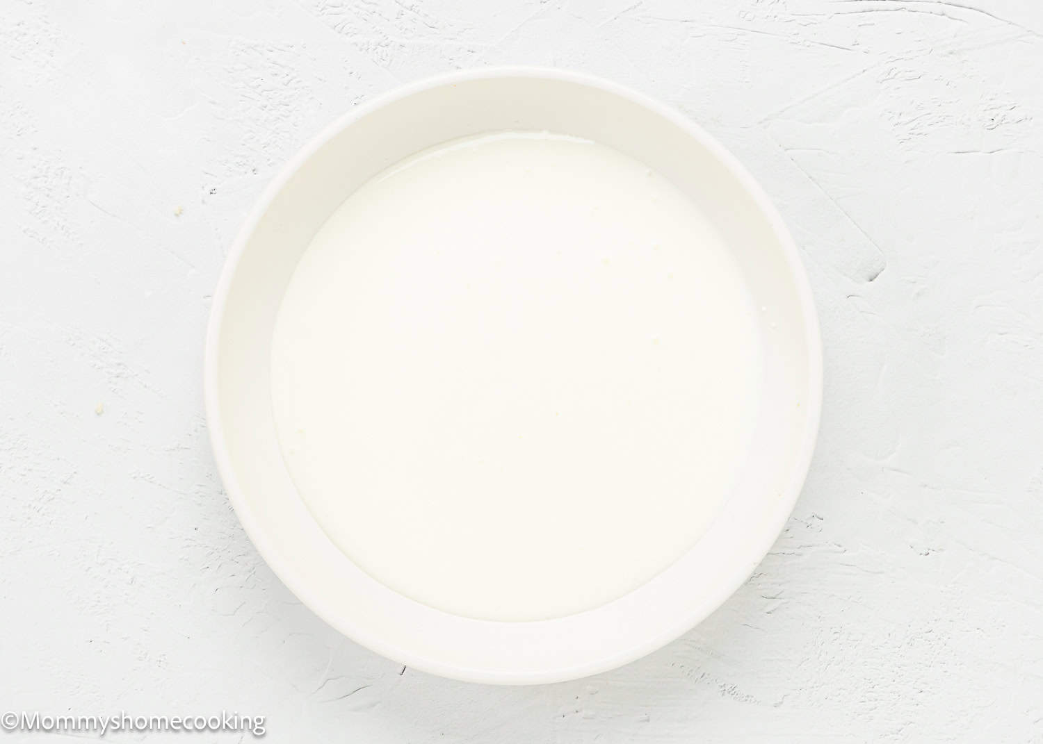 milk and yogurt mix together in a shallow bowl.