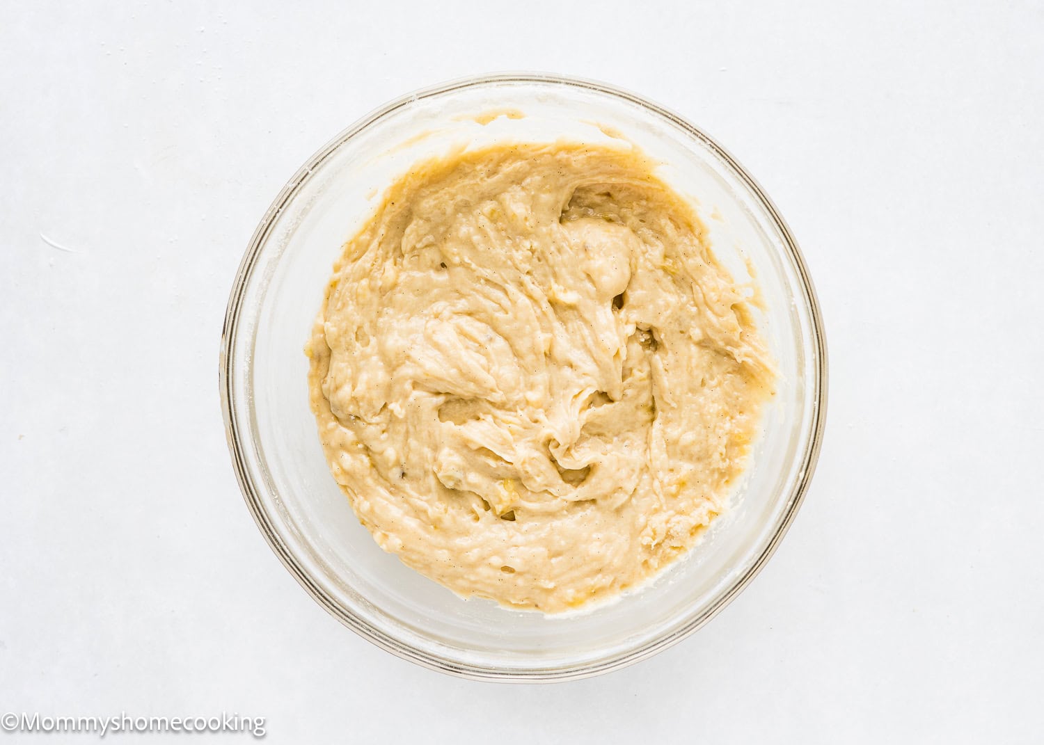 Healthy Easy Banana Muffins batter made with no eggs, dairy or sugar in a bowl.