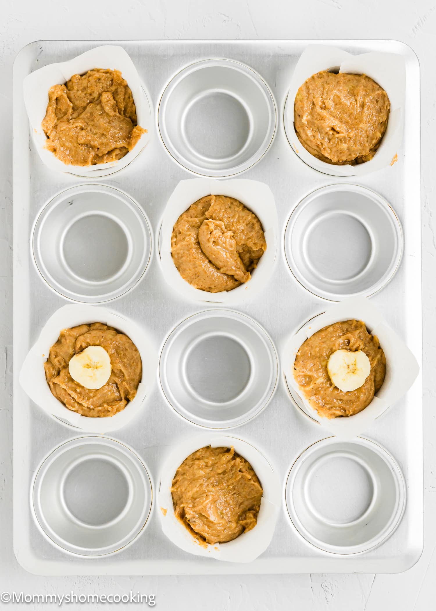 unbaked Healthy Easy Banana Muffins in a muffins tin.