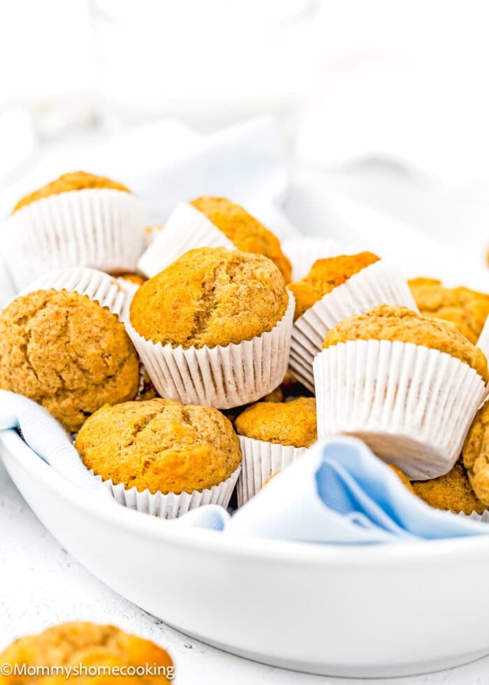 Healthy Mini Banana Muffin in a serving bowl over a white surface.