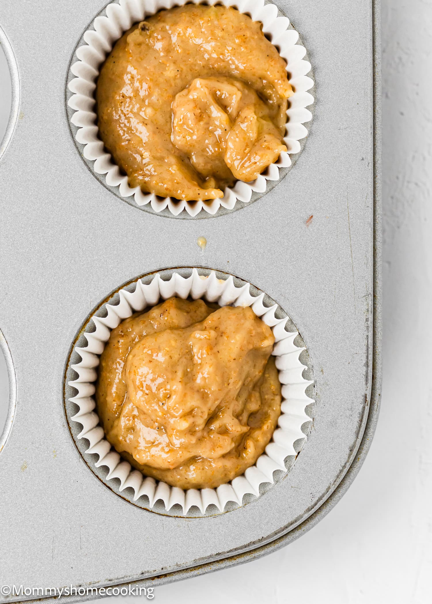 unbaked Healthy Egg-Free, dairy-free and Vegan Mini Banana Muffins in a muffin tin.