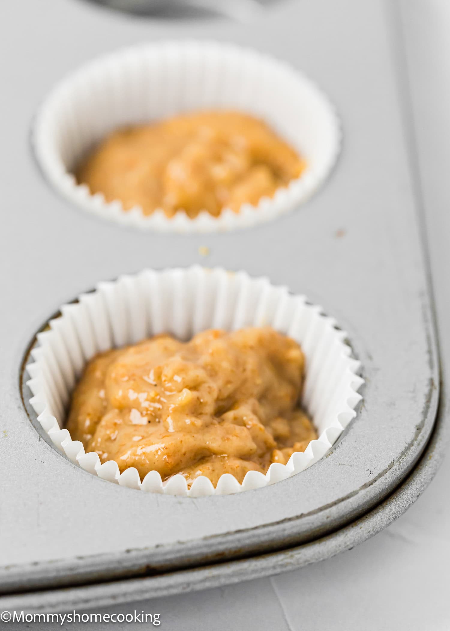unbaked Healthy Mini Banana Muffins in a muffin tin.