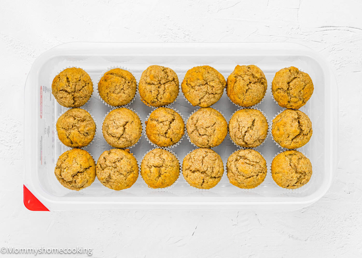 Healthy Mini Banana Muffins in a freezer container.