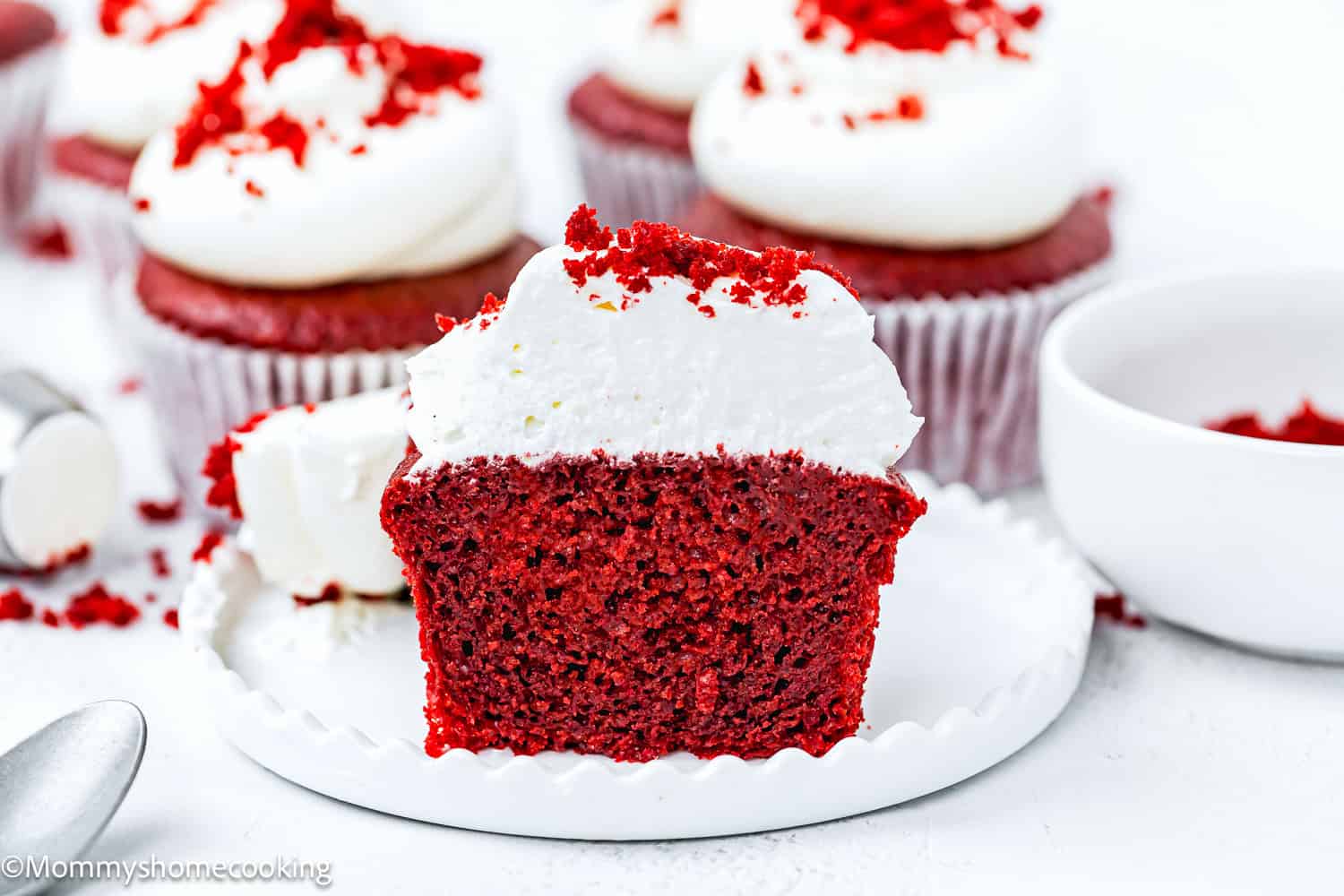Vegan Red Velvet Cupcake cut in half showing its perfect fluffy texture.