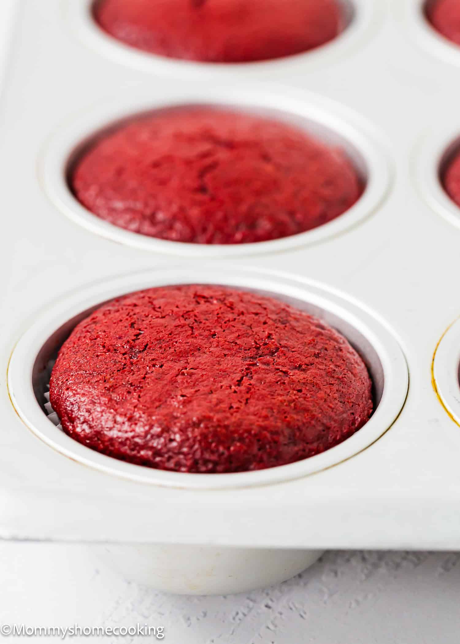 baked Vegan Red Velvet Cupcakes in a cupcake pan.