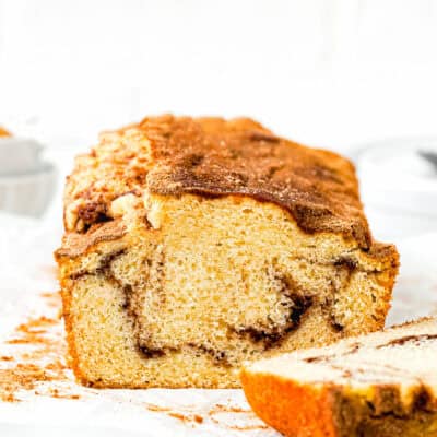 Vegan Cinnamon Swirl Quick Bread sliced showing its perfect inside texture over a white surface.