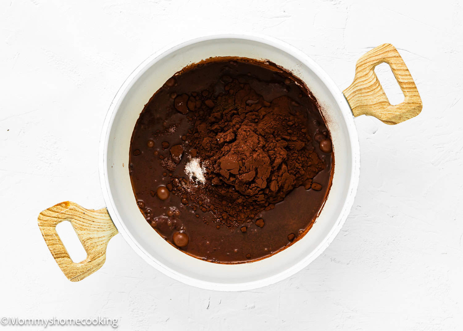 Ingredients needed to make Easy Chocolate Hot Fudge Sauce in a pot.