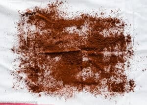 a kitchen towel sprinkled with cacao.