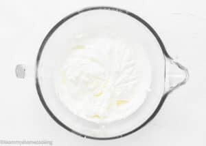 whipped cream in a stand mixer bowl.