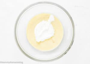 mixture to make Eggless Vanilla Ice Cream being mixed with whipped cream.