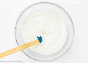 Unfrozen Eggless Vanilla Ice Cream mixture in a bowl with a spatula.