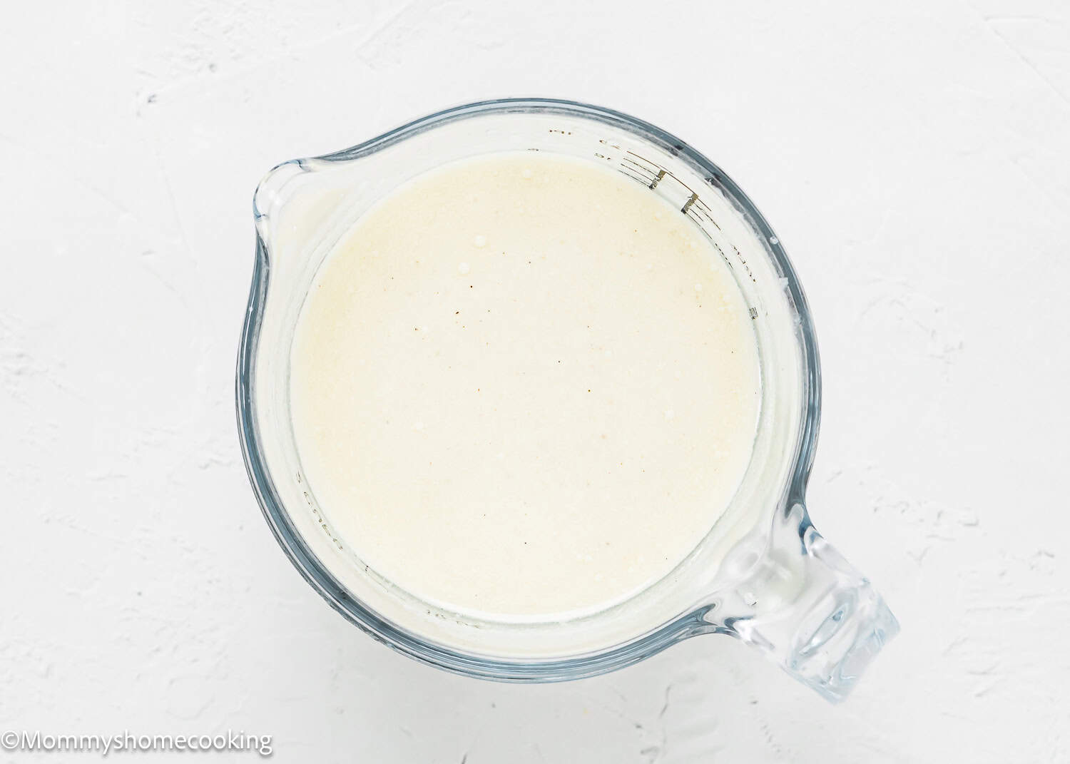 wet ingredients to make eggless Easy Pistachio Cake batter in a bowl.