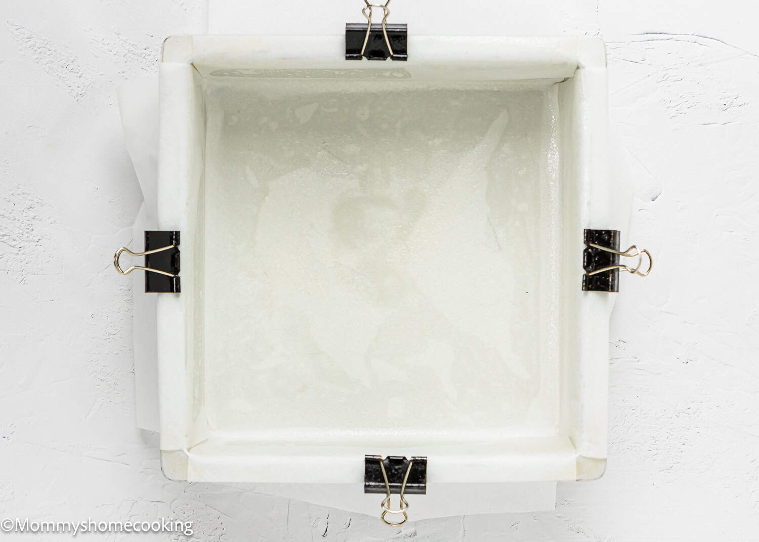 cake pan lined with parchment paper.