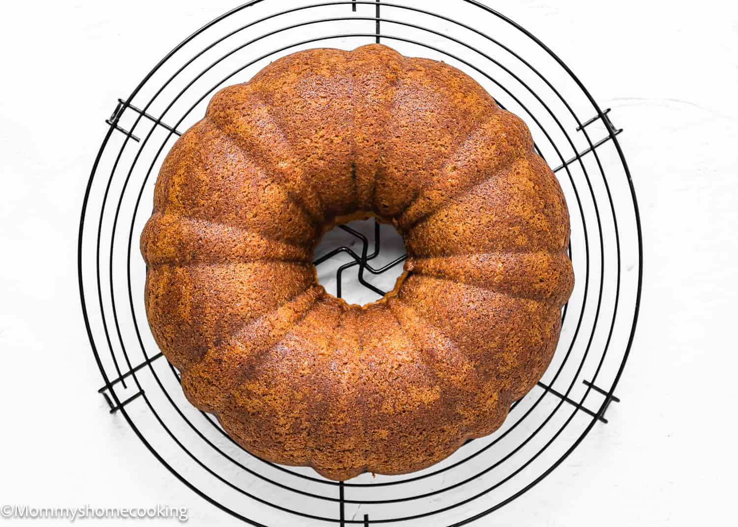 baked whole Egg-free Brown Butter Banana Bundt Cake on a cooling rack.