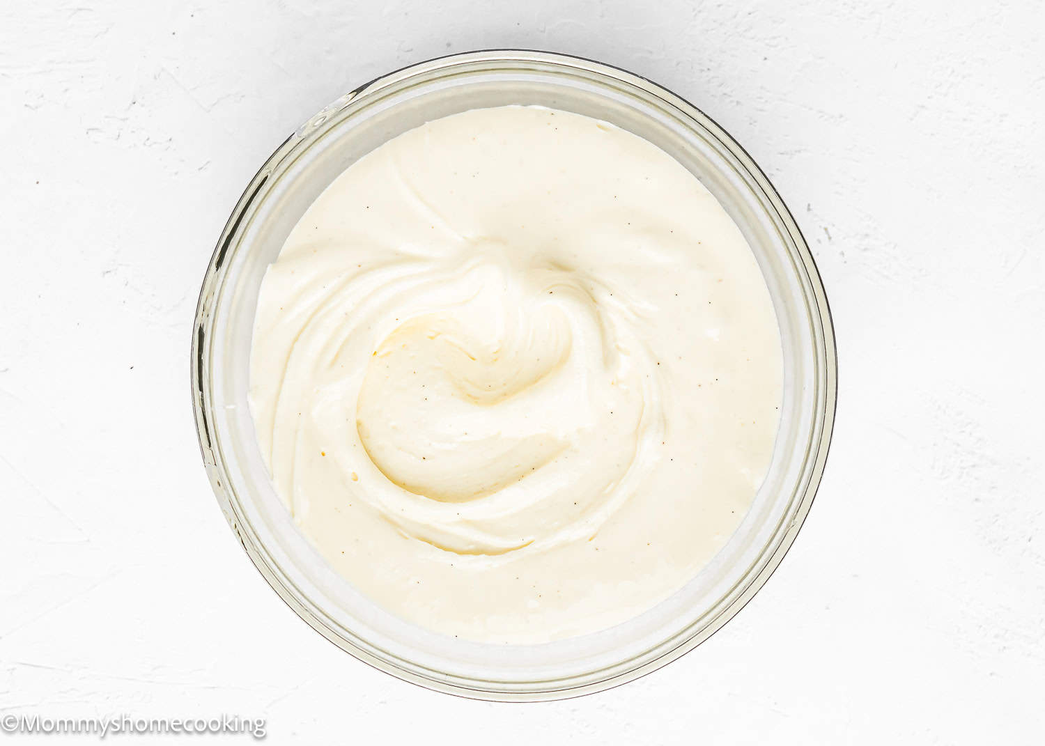 cream cheese glaze for cake in a bowl.