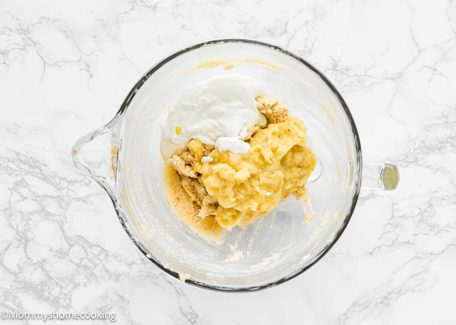 wet ingredients to make Eggless Brown Butter Banana Bundt Cake batter in a stand mixer bowl.