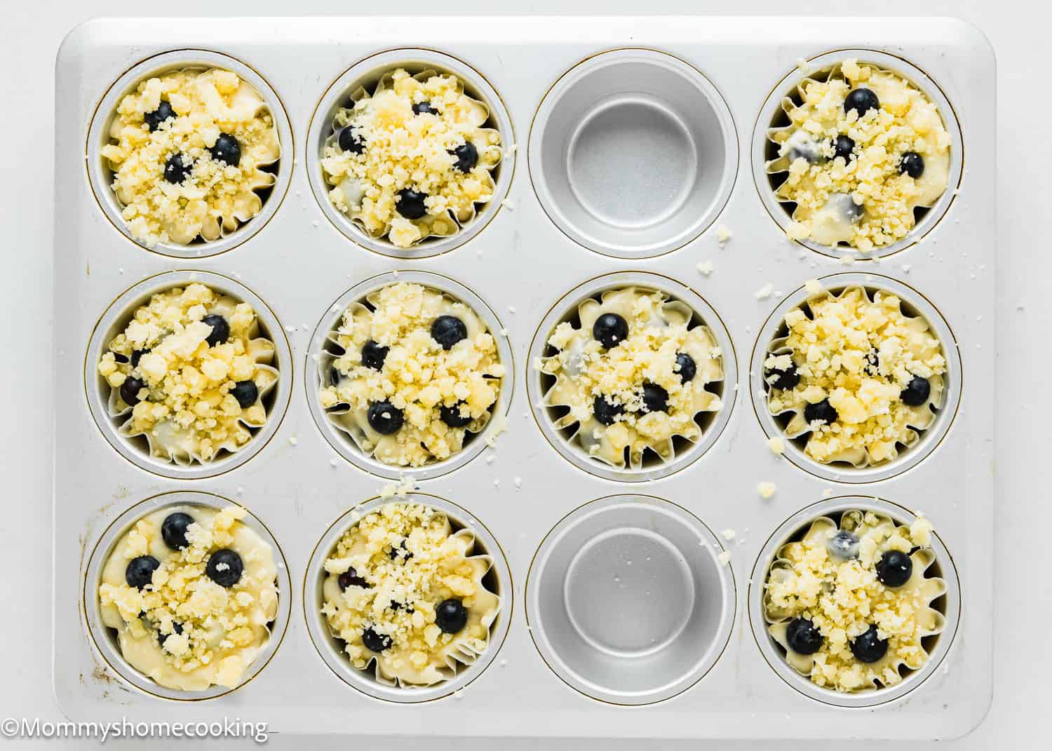 unbaked Easy Vegan Blueberry Muffins in a muffin tin.