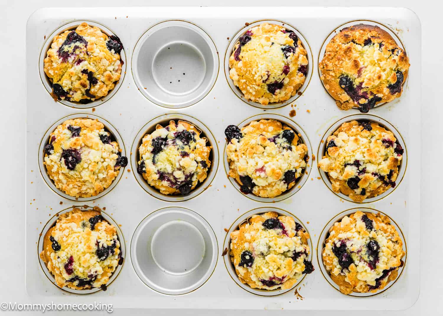 baked Easy Vegan Blueberry Muffins in a muffin tin.