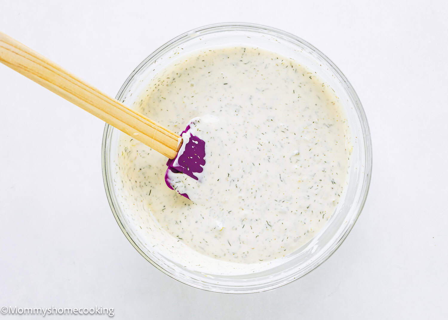 Homemade Easy Vegan Tartar Sauce in a bowl with a spatula.