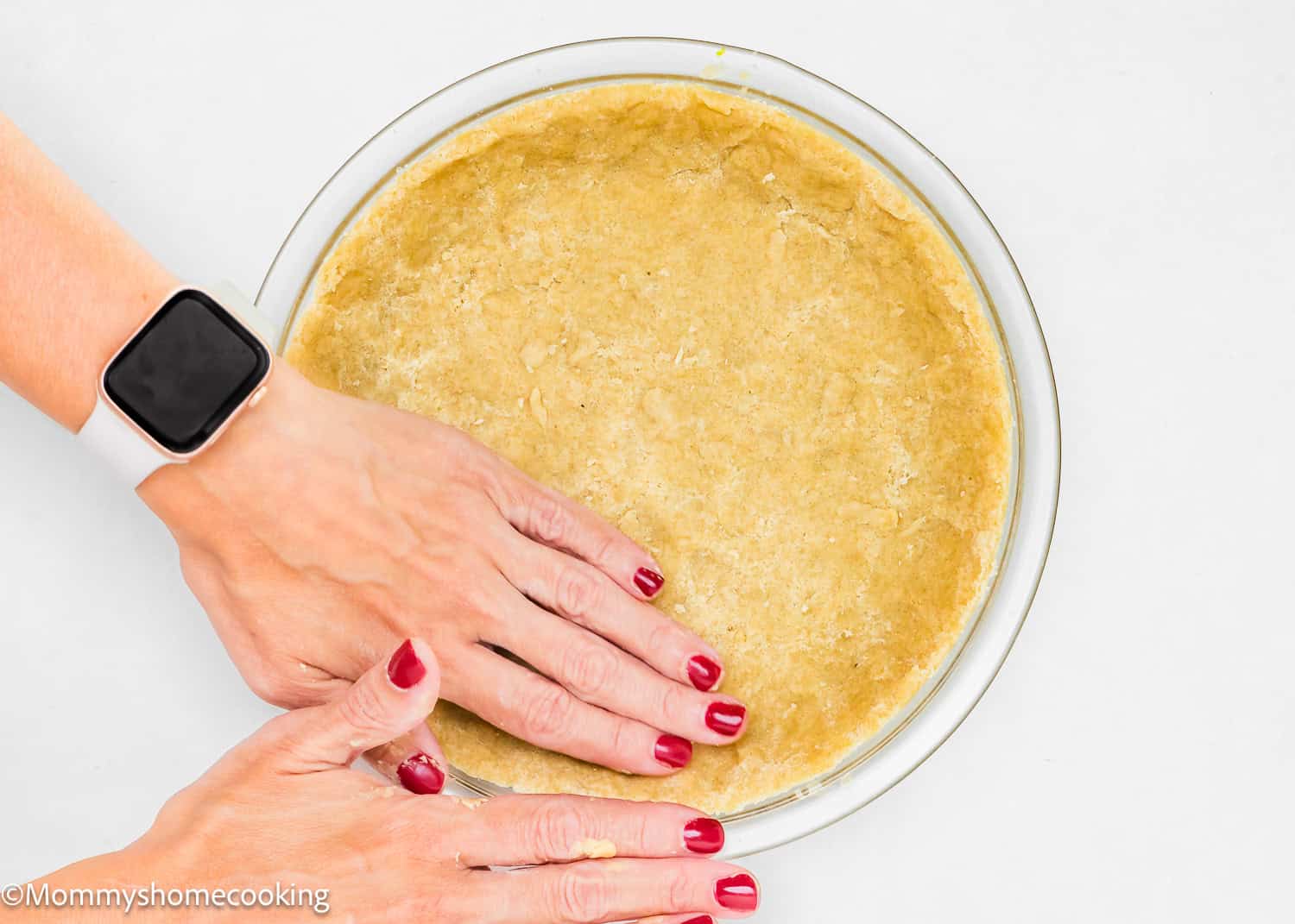 Effortlessly press the dough into the pie dish, embracing a no-fuss approach for an easy press-in pie crust.