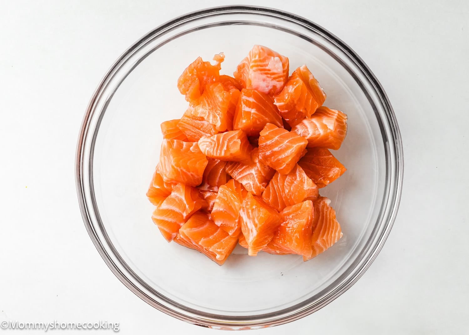 cubed fresh salmon in a bowl. 
