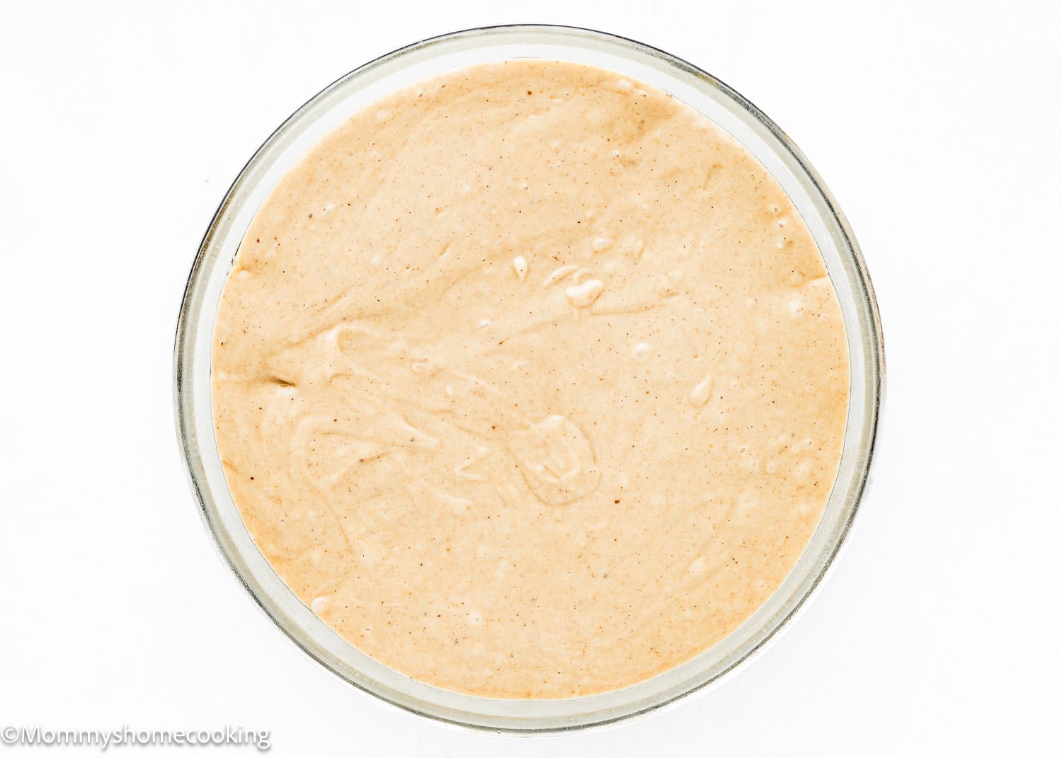 unbaked Eggless Easy Apple Upside Down Cake in a beep pie dish.