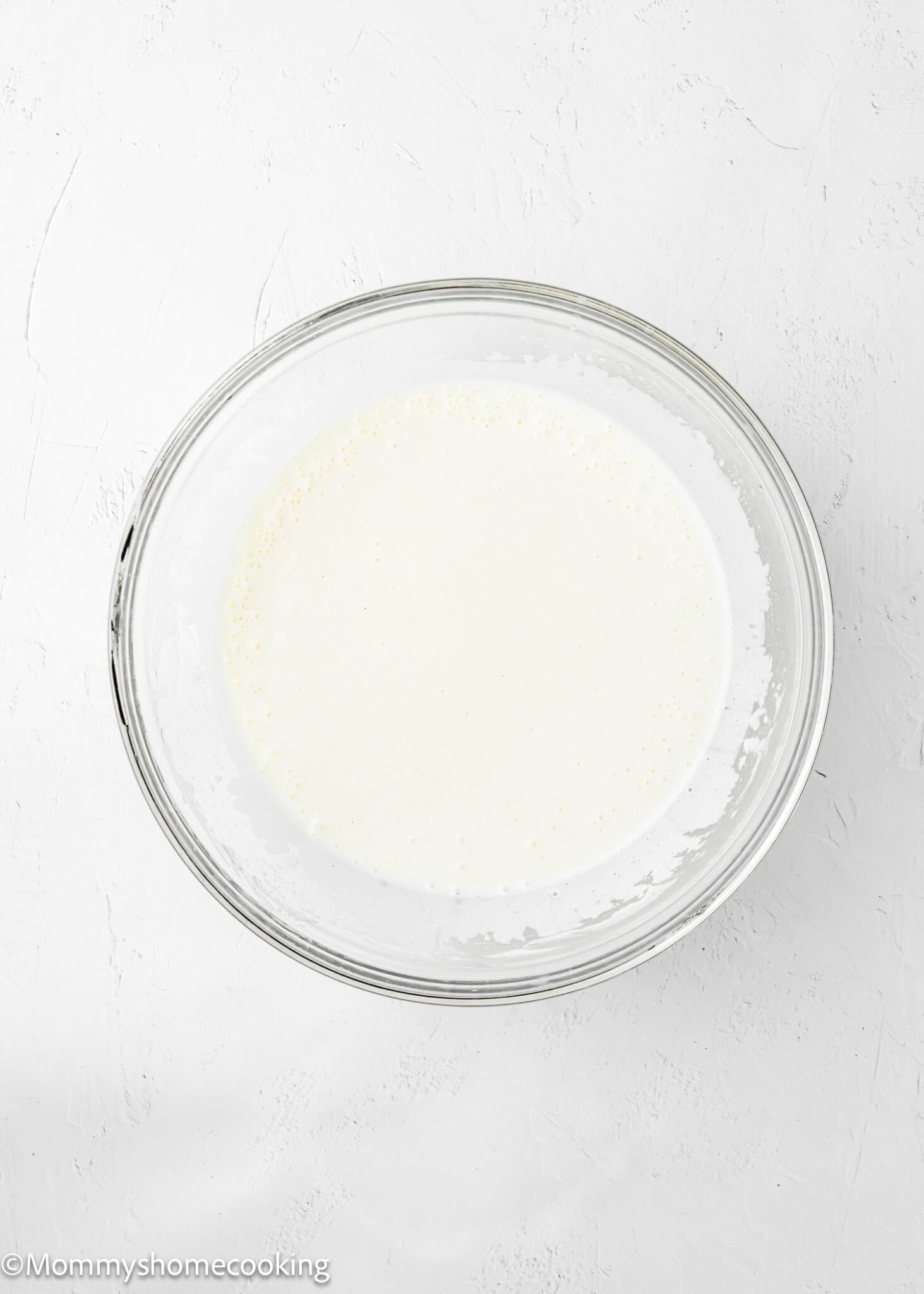 wet ingredients to make Eggless Lemon Poke Cake in a bowl.