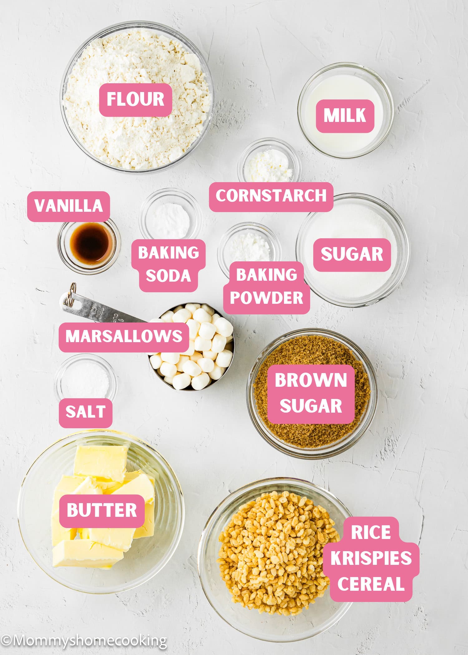 Top-down view of labeled baking ingredients for Easy Marshmallow Rice Crispy Cookies (Costco Copycat – Egg-Free), including flour, milk, cornstarch, sugars, butter, salt, marshmallows, vanilla, leaveners, and Rice Krispies cereal.
