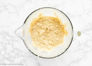 wet ingredients make Eggless Banana Layer Cake in a stand mixer bowl.