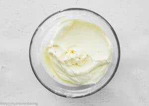 Maple cinnamon rolls icing in a bowl.