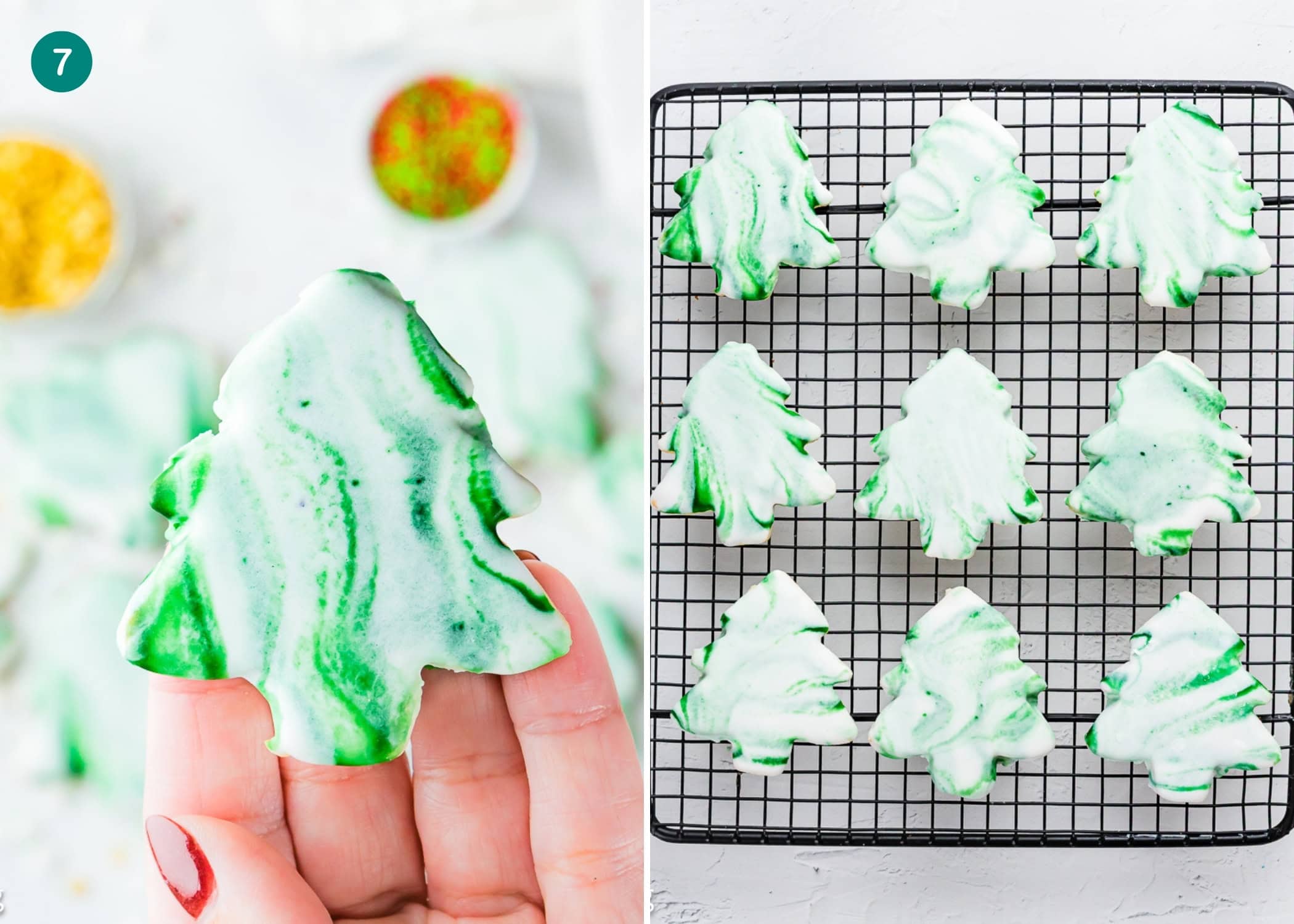 A hand holds an Eggless Marble Christmas Tree Cookie with green and white icing, while more similarly decorated cookies cool on a wire rack nearby.
