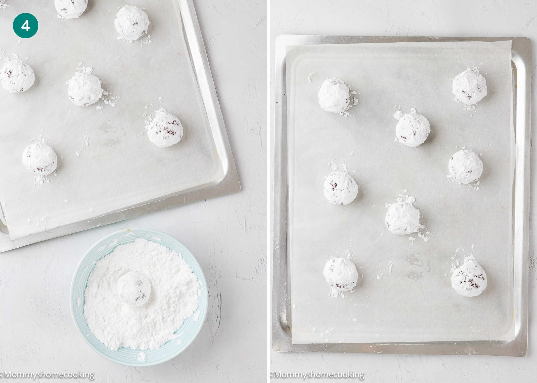 Two baking trays lined with parchment paper hold evenly spaced Eggless Red Velvet Crinkle Cookies coated in powdered sugar, with a bowl of powdered sugar nearby.