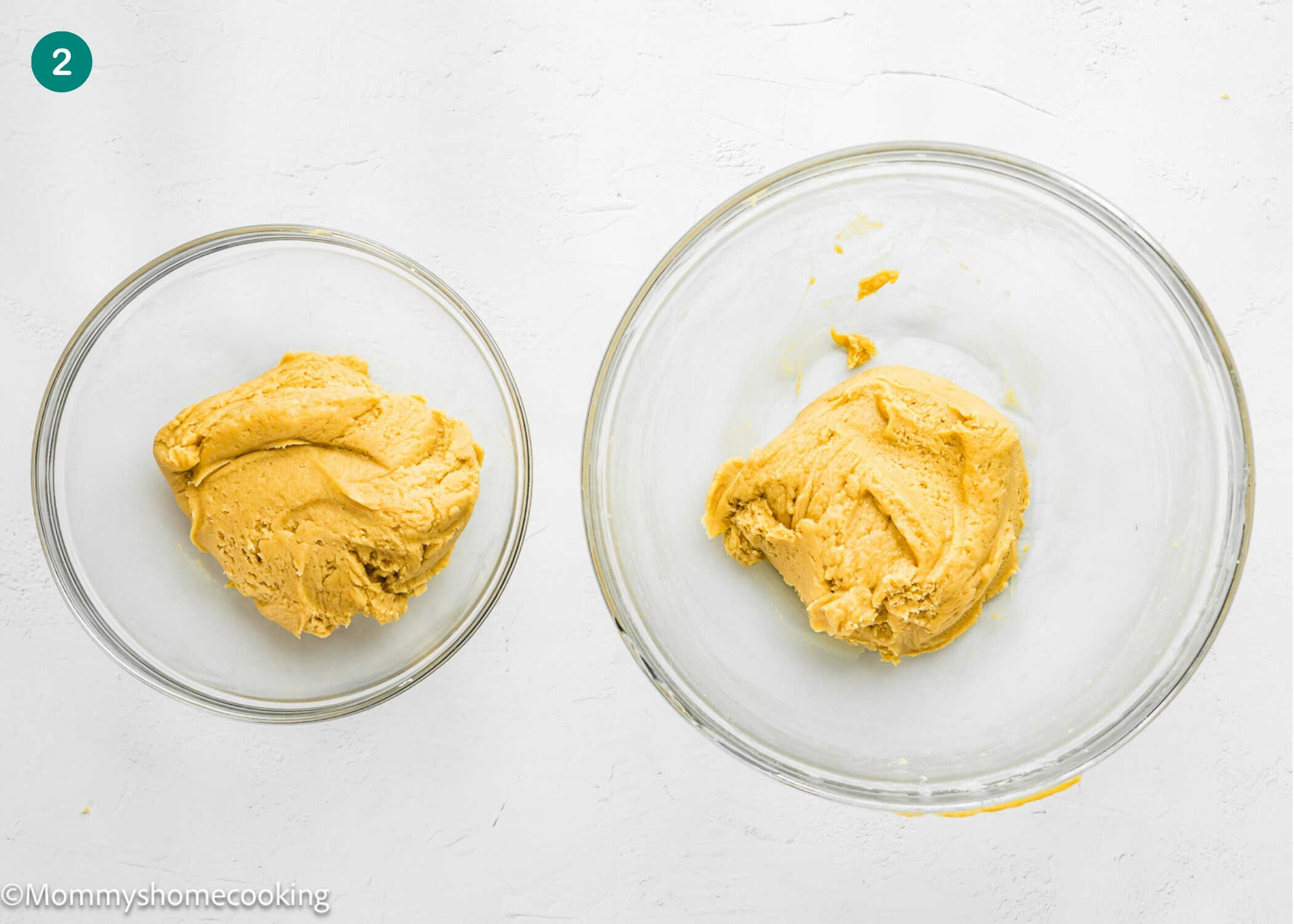 Two glass bowls filled with yellowish dough for Eggless Brookie Cookies (One Dough) are placed on a white surface.