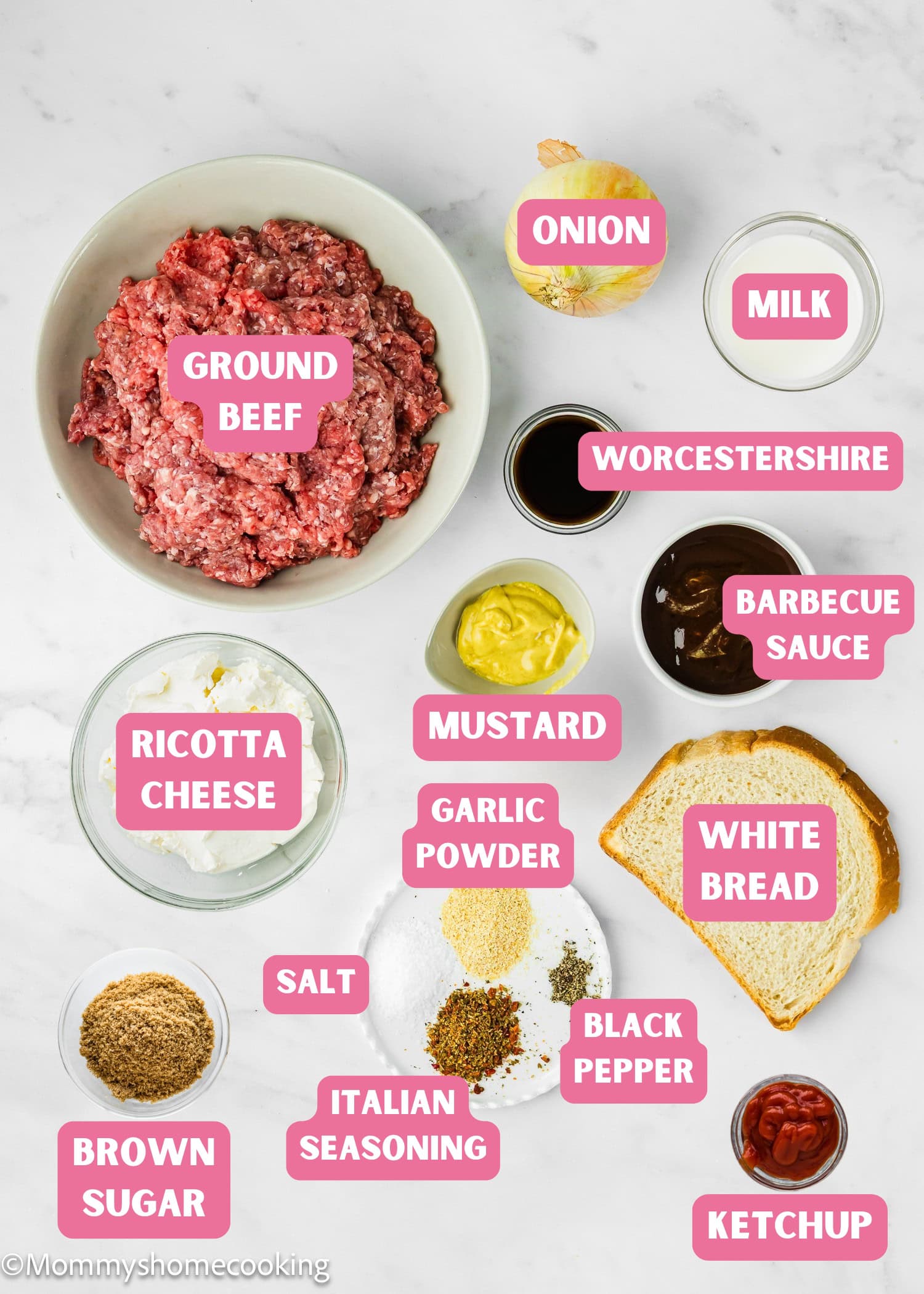 Overhead view of labeled ingredients for Mini Meatloaf Muffins (No Eggs!), featuring ground beef, ricotta cheese, onion, milk, Worcestershire sauce, barbecue sauce, mustard, bread, seasonings, brown sugar, and ketchup.